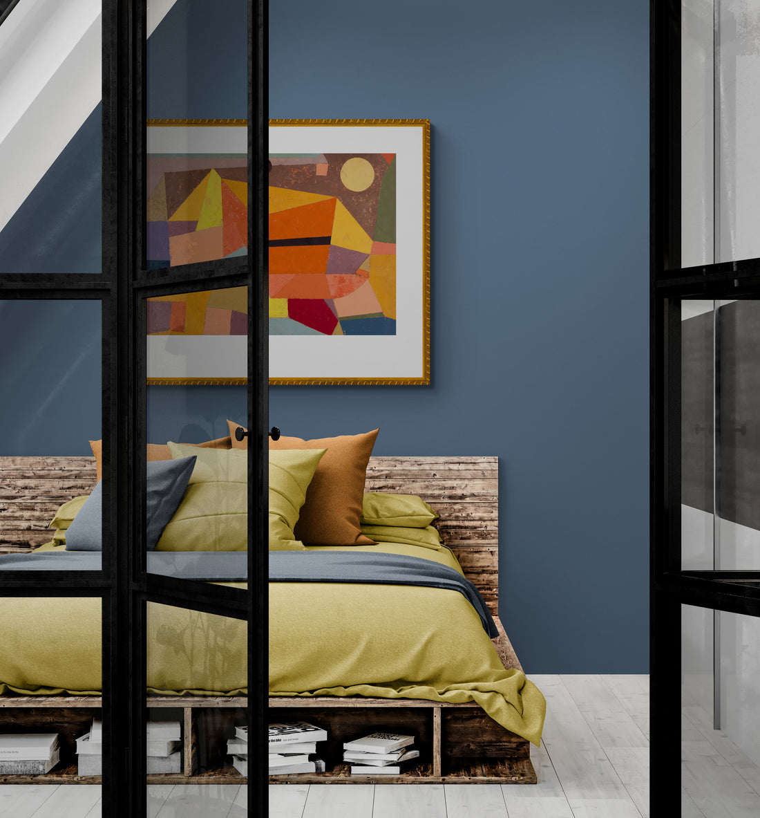 A modern-rustic bedroom in an attic with blue wall an a framed abstract art print by Paul Klee.